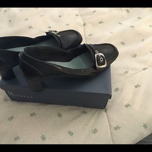 Black Leather shoe with buckle instep two inch block heel.